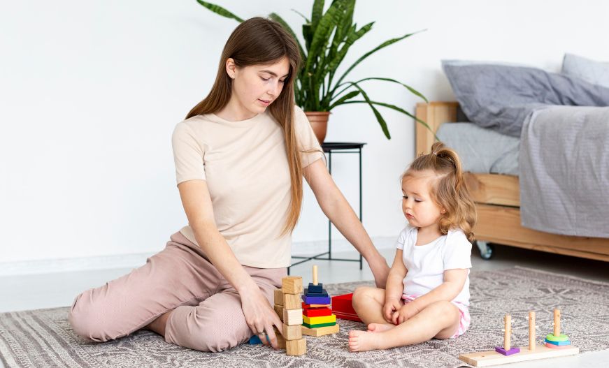 Role Of Teacher In Holistic Development Of A Child Blog Image. A kid and teacher playing